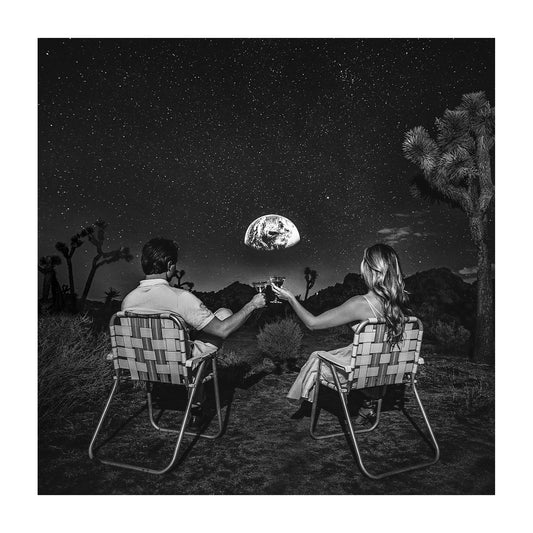 A couple sitting in midcentury modern lawn chairs enjoying martinis on the moon while watching the earth rise against starry skies. 