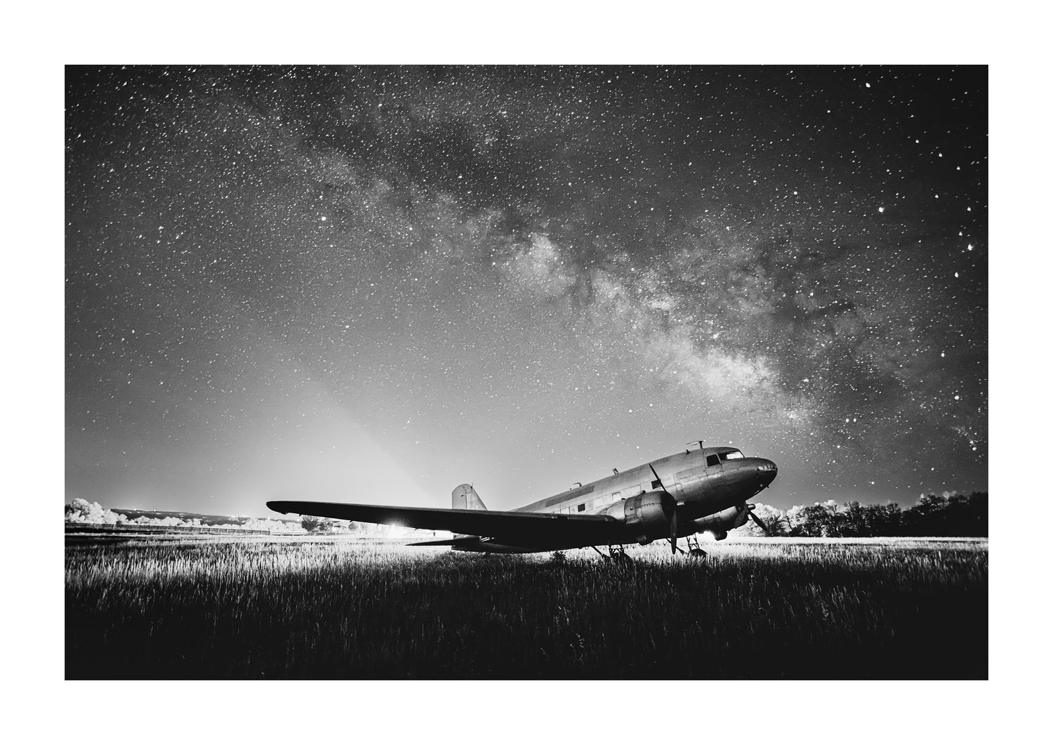 black and white aviation photograph of a dc-3